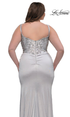 A woman shown from the back against a white background wears the Plus-Size Long Satin Prom Dress La Femme 32430: a silver, floor-length gown featuring spaghetti straps and a rhinestone-beaded bodice.