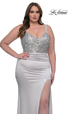 A woman models the La Femme 32430, a plus-size long satin prom dress featuring a rhinestone-beaded bodice and thigh-high slit, standing before a white background with the "La Femme" logo.