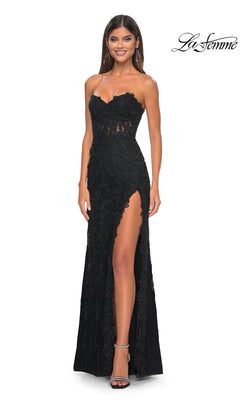A woman stands smiling in the Beaded-Lace Long Prom Dress: La Femme 32437—a strapless black gown with a sweetheart neckline, high slit, and intricate beaded lace. The La Femme logo is visible in the top right corner.