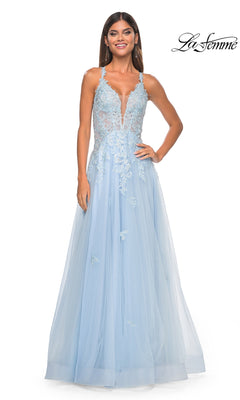 A woman smiles against a white backdrop in the La Femme 32438: a light blue, sleeveless, floor-length formal dress with embroidered lace, tulle skirt, and sheer waist. The La Femme logo appears at the top right.