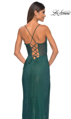 A woman models the Sheer-Bodice Long La Femme Fishnet Prom Gown 32446, showcasing its sparkly fabric, corset-style bodice, lace-up open back, and thin crisscross straps, photographed from behind on a white background.