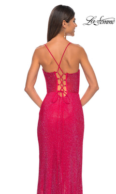 Woman wearing the Sheer-Bodice Long La Femme Fishnet Prom Gown 32446, featuring a sparkling red corset-style bodice with lace-up back and thin straps, shown from behind against a white background.