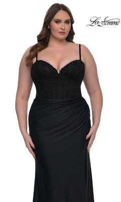 A woman models the Plus-Size Long Corset Prom Dress: La Femme 32449, a black sleeveless gown with a beaded bodice and draped skirt, against a white background. The "La Femme" logo appears in the corner.