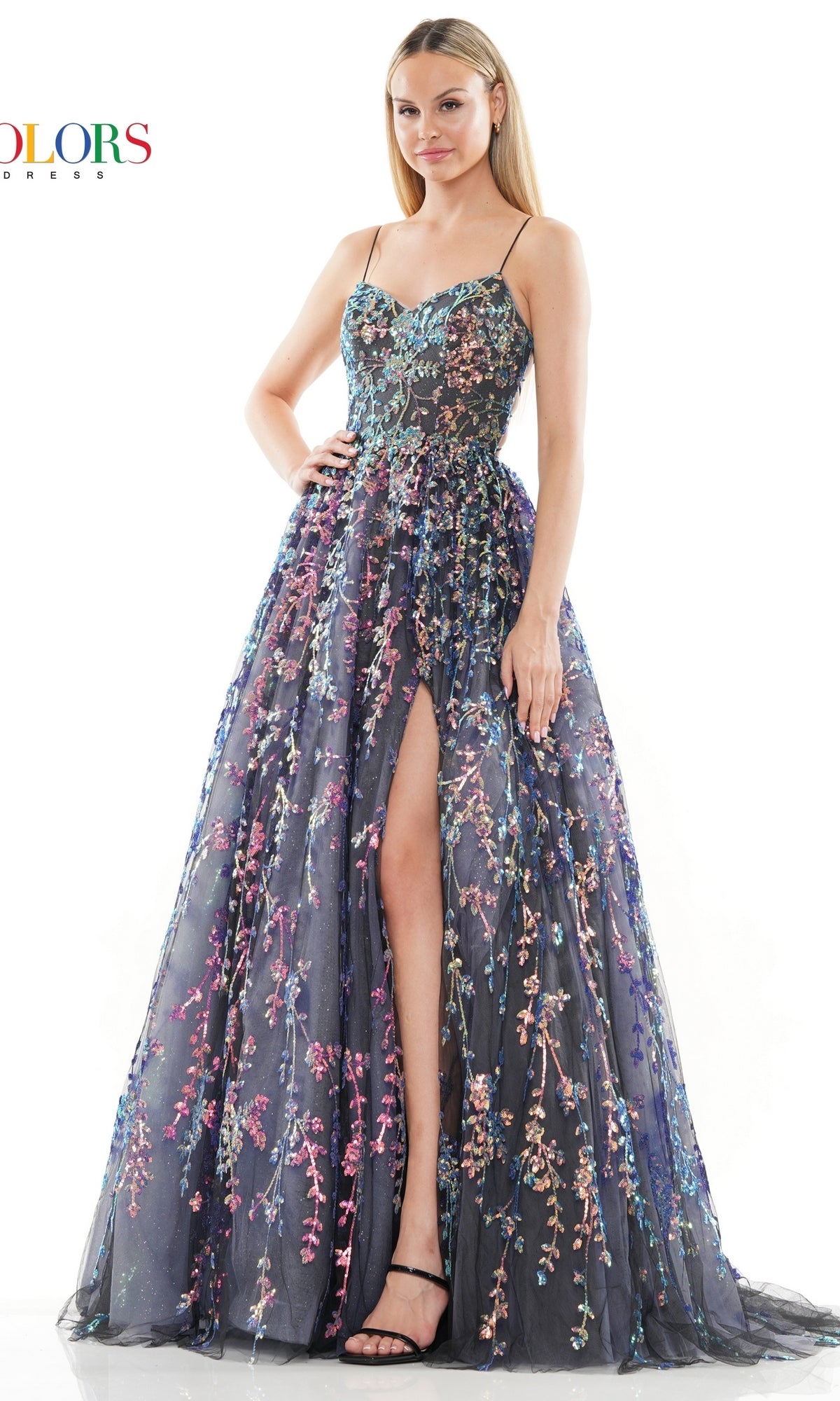 A woman in the Sequin-Embroidered Backless Long Prom Dress 3247, a floor-length dark A-line gown with floral embroidery and a front slit, poses against a white background.