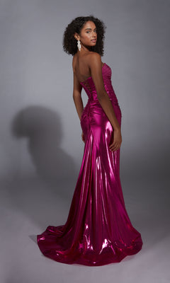 A woman models the Strapless Long Metallic Prom Dress: Aerie Couture 324, posing with her back to the camera in a shiny magenta gown against a plain gray background.