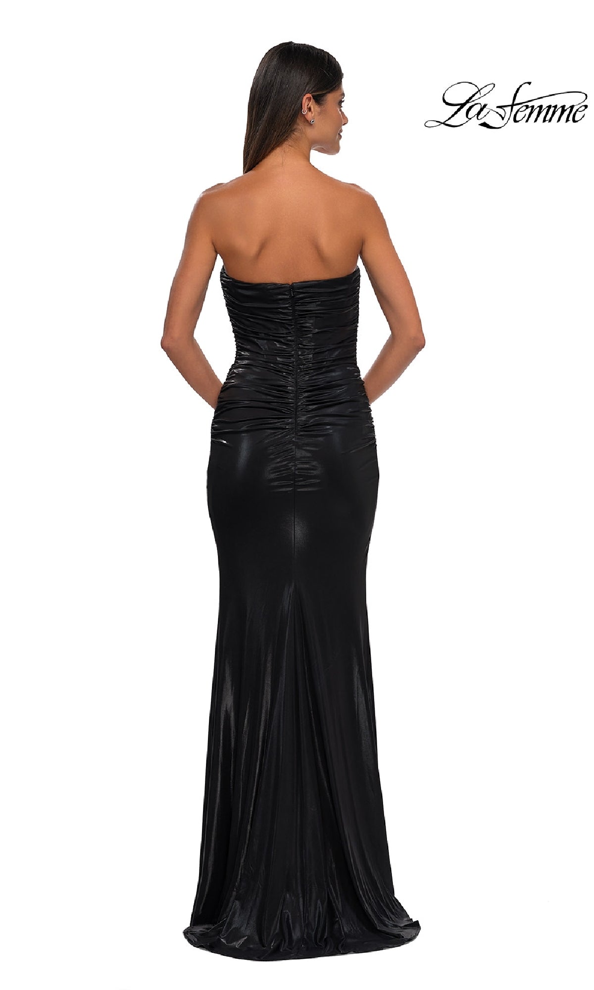 A woman stands confidently against a plain white background wearing the La Femme 32518 Long Strapless Tube Prom Dress, a floor-length black gown with ruched back. The 