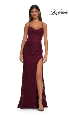 A woman models the Sheer-Sides Long Beaded Prom Dress (La Femme 32529), a sleeveless deep red gown with a thigh-high slit and subtle sparkle, before a white background. “La Femme” is displayed in the top right corner.