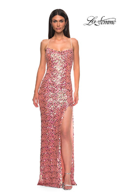 A woman models the Long Pink Prom Dress: La Femme 32550, featuring pink sequins, a high leg slit, thin straps, and a strappy open back. She stands against a white background with the La Femme logo in the top right corner.