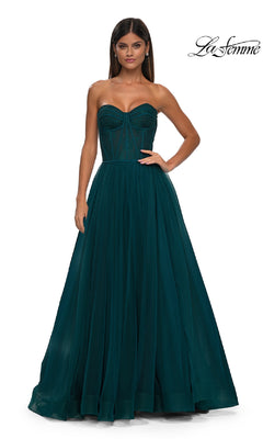 A woman models the Strapless Long Prom Ball Gown: La Femme 32579 in dark teal with a floral corset-style bodice and full skirt. The background is white, and "La Femme" is shown in the top right corner.