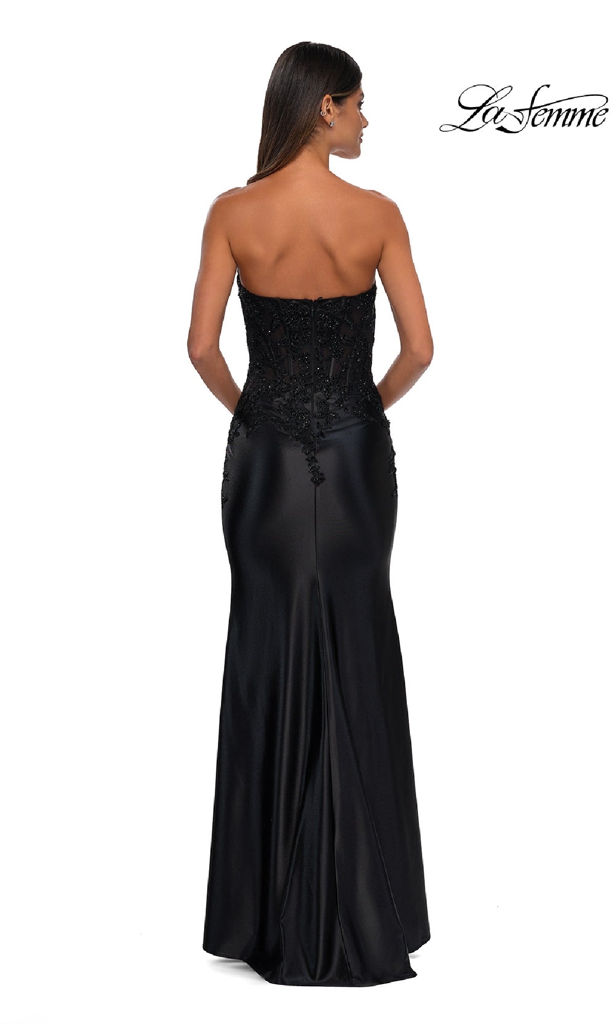 Woman modeling the Tight Strapless Long Prom Dress: La Femme 32582, featuring a fitted beaded bodice and smooth satin skirt, shown from the back. 
