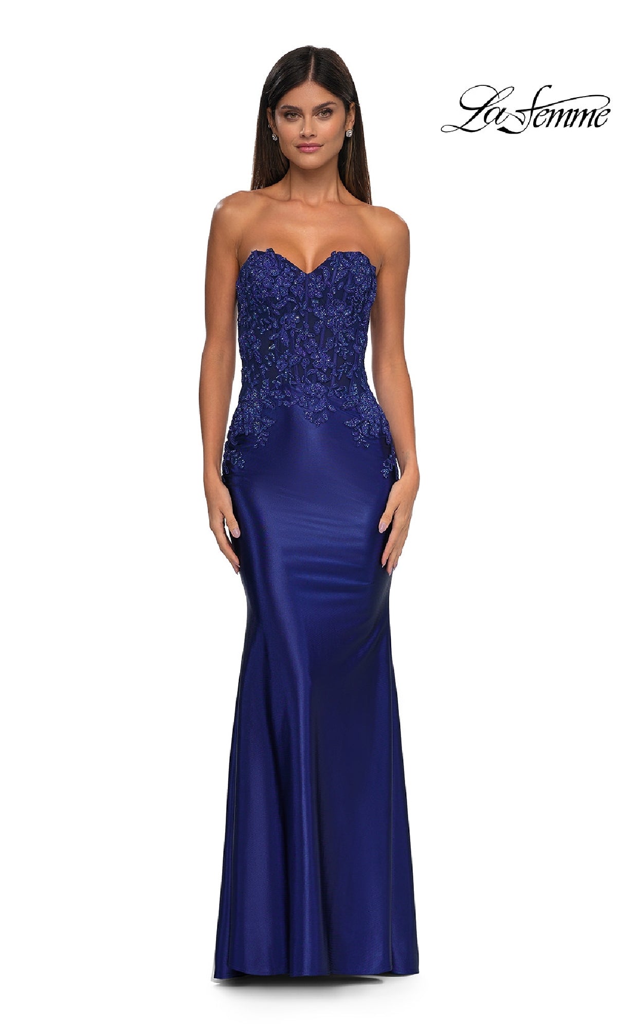A woman models the Tight Strapless Long Prom Dress: La Femme 32582 in royal blue, featuring a beaded bodice and lace details, against a plain white background.