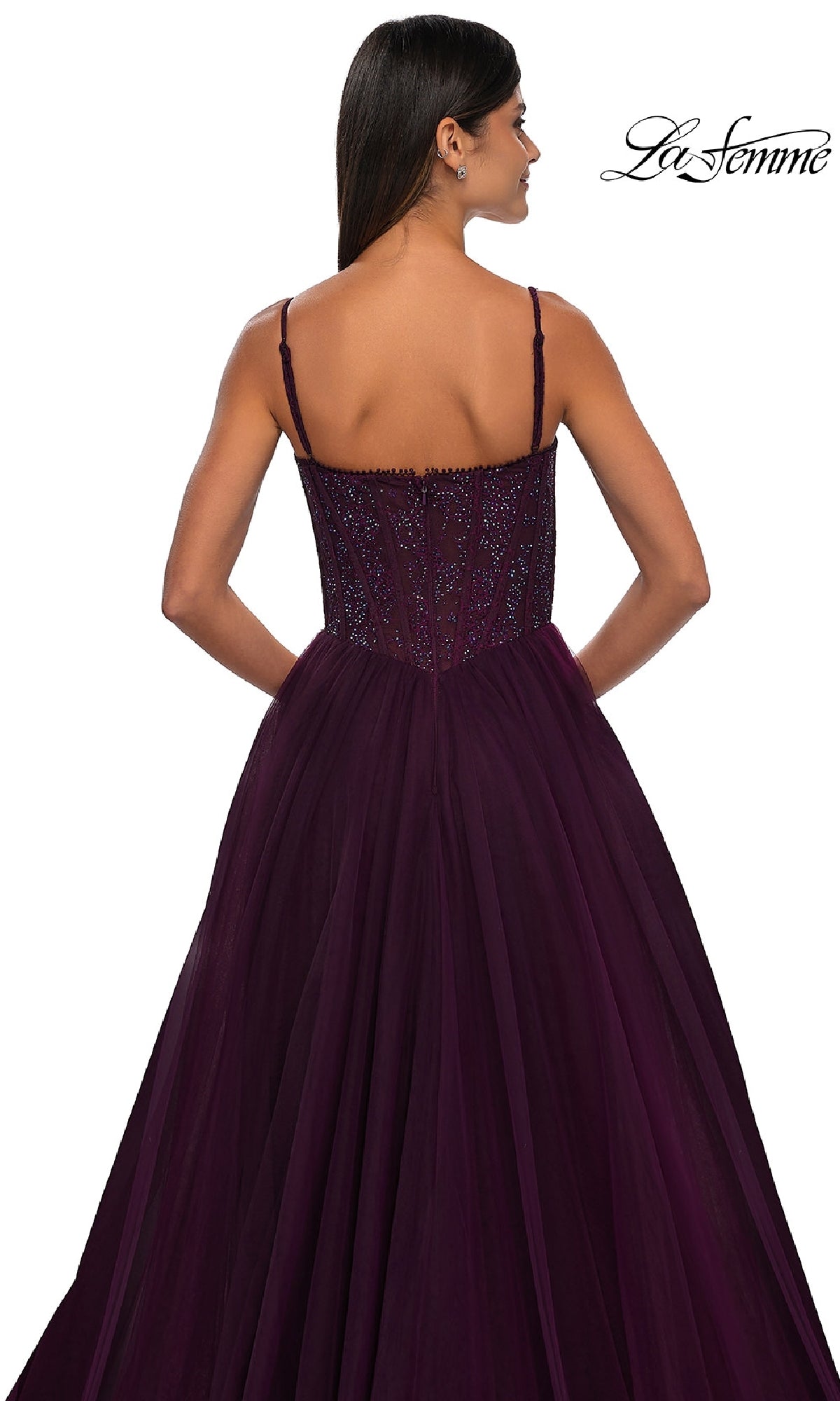 A woman is shown from the back wearing the Beaded-Bodice Long Prom Ball Gown: La Femme 32594 in dark purple with thin straps, against a white background. The La Femme logo appears in the top right corner.