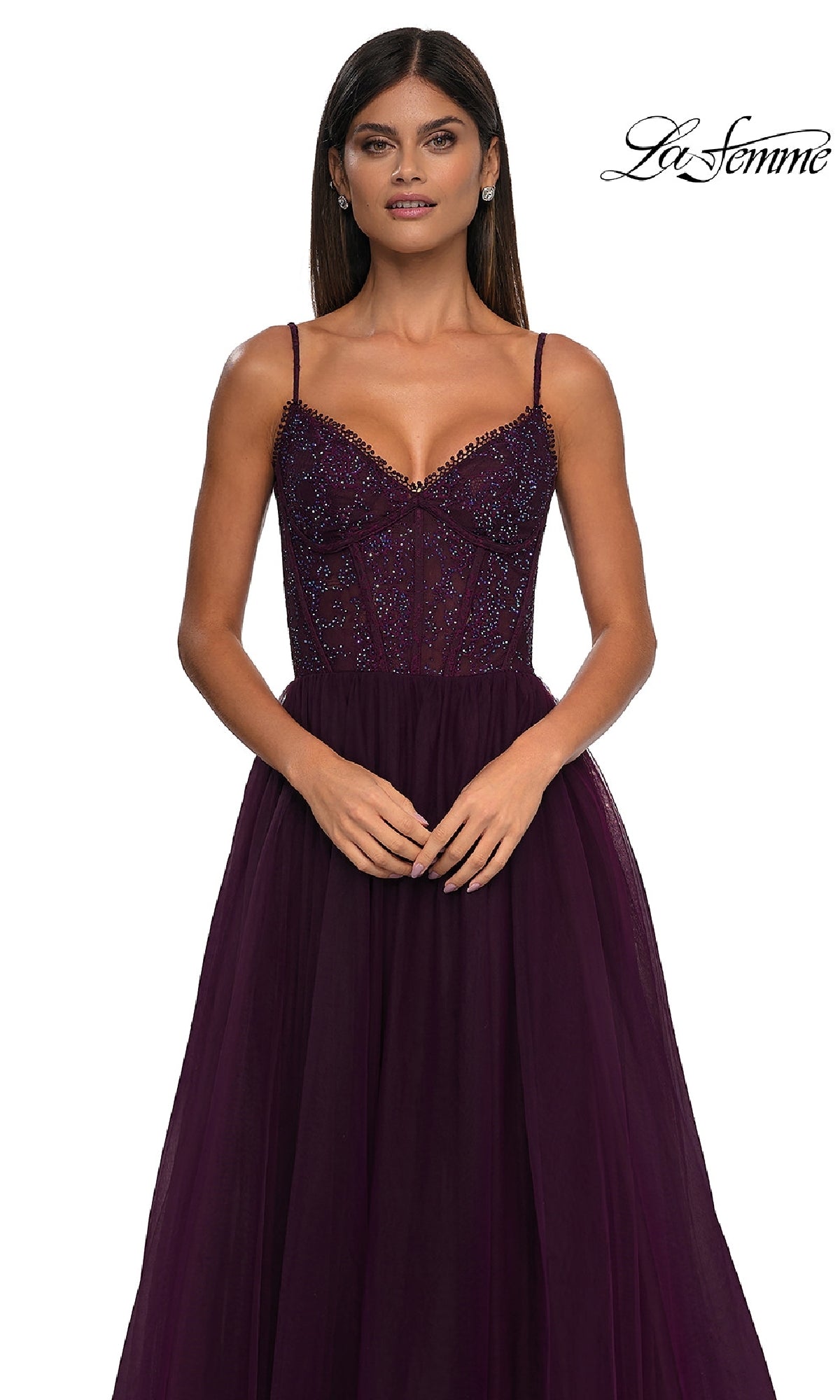 A woman poses against a white background in the La Femme 32594 Beaded-Bodice Long Prom Ball Gown, a sleeveless deep purple dress with thin straps. The 