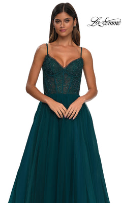 A woman stands against a plain white background wearing the La Femme 32594 Beaded-Bodice Long Prom Ball Gown in dark green, featuring a sleeveless design, fitted beaded bodice, and tulle skirt.