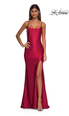 Woman in the Sheer-Back Simple Long Prom Dress (La Femme 32640), a sleeveless, floor-length red satin gown with thin straps and a high thigh slit, stands with one hand on her hip. La Femme logo appears in the top right corner.