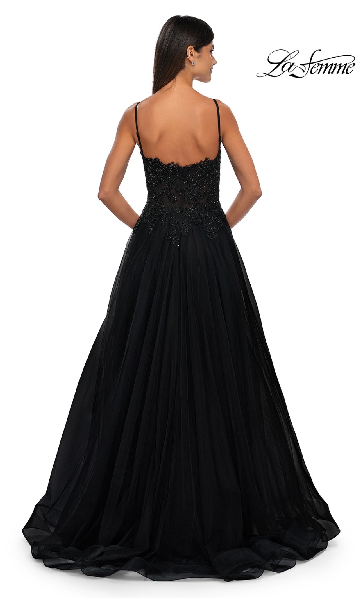 A woman is shown from the back wearing the La Femme 32646 long prom ball gown with pockets, featuring a fitted, embellished bodice and a flowing skirt. The La Femme logo appears in the top right corner.