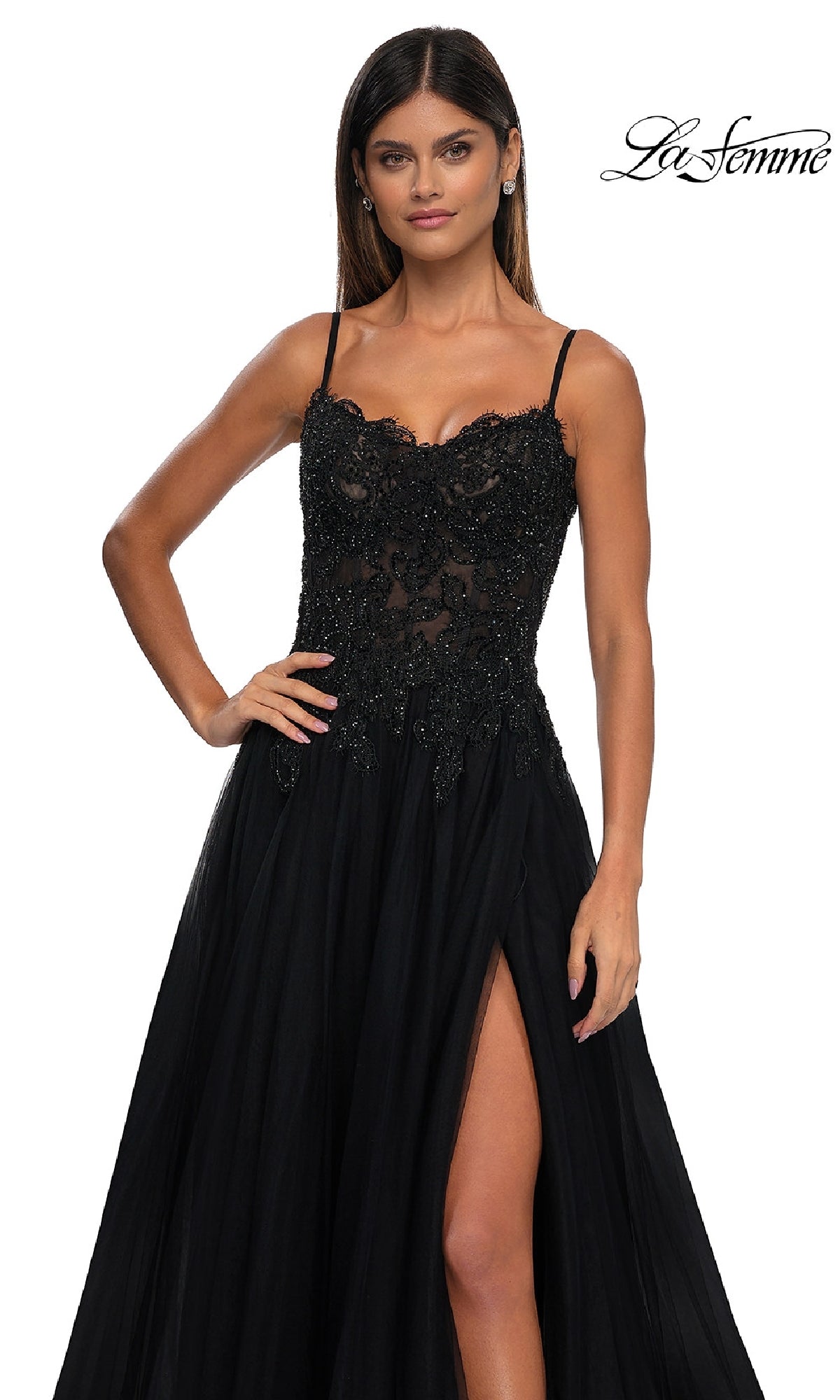A woman wearing the Long Prom Ball Gown with Pockets: La Femme 32646 in black stands against a plain white background, with the 