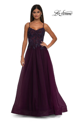 A woman stands against a plain white background wearing the La Femme 32646, a sleeveless, floor-length dark purple prom ball gown with pockets, featuring a beaded lace bodice and a flowing tulle skirt.