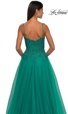 Woman wearing a sleeveless, emerald green La Femme 32646 long prom ball gown with lace and beaded bodice detailing, photographed from the back.