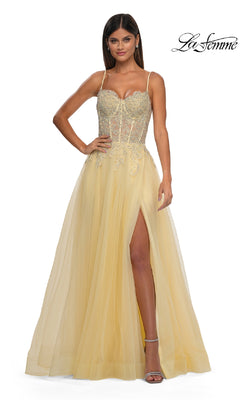 A woman stands against a white background wearing the La Femme 32646 Long Prom Ball Gown with Pockets, featuring a sleeveless design, fitted embellished bodice, and thigh-high slit.