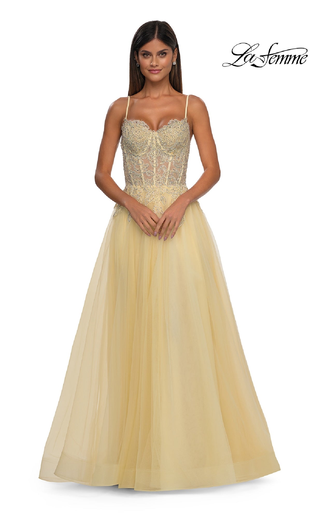 A woman poses against a white background wearing the La Femme 32646 long prom ball gown with pockets, featuring a fitted embellished bodice and tulle skirt. The La Femme logo is displayed in the top right corner.