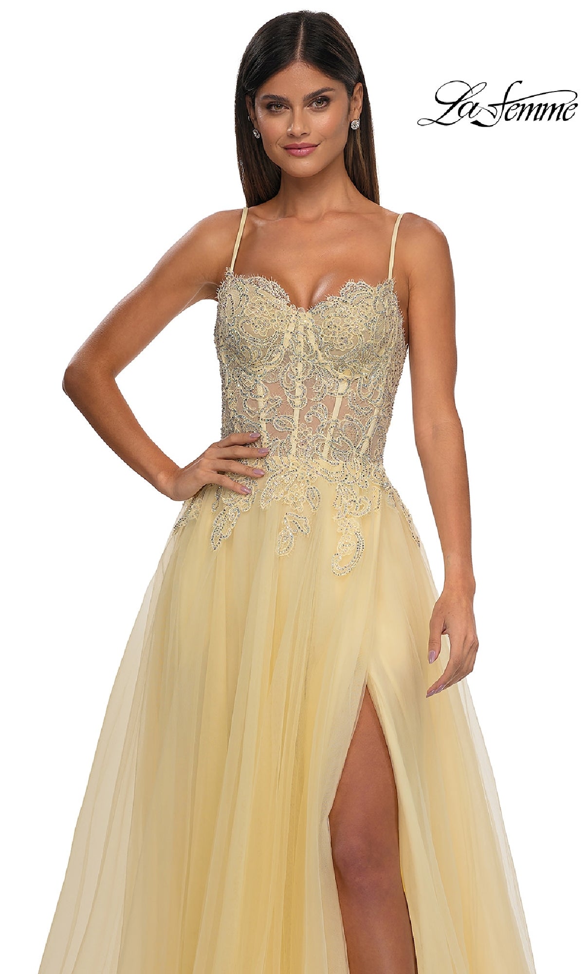 Woman wearing the La Femme 32646 long prom ball gown with pockets, featuring a yellow embellished design, sheer beaded bodice, spaghetti straps, and thigh-high slit. The La Femme logo is in the top right corner.