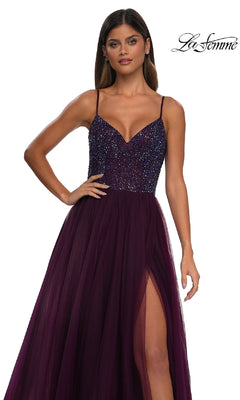 A woman models the La Femme 32668 Beaded-Bodice Long Prom Ball Gown in deep purple with a v-neck, thin straps, and high-slit skirt against a white background. The La Femme logo is shown in the top right corner.