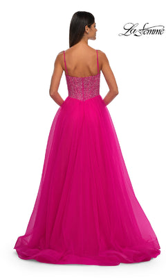 Woman modeling the Beaded-Bodice Long Prom Ball Gown La Femme 32668 in vibrant pink, featuring thin straps and a beaded v-neck bodice, shown from the back against a plain white background.