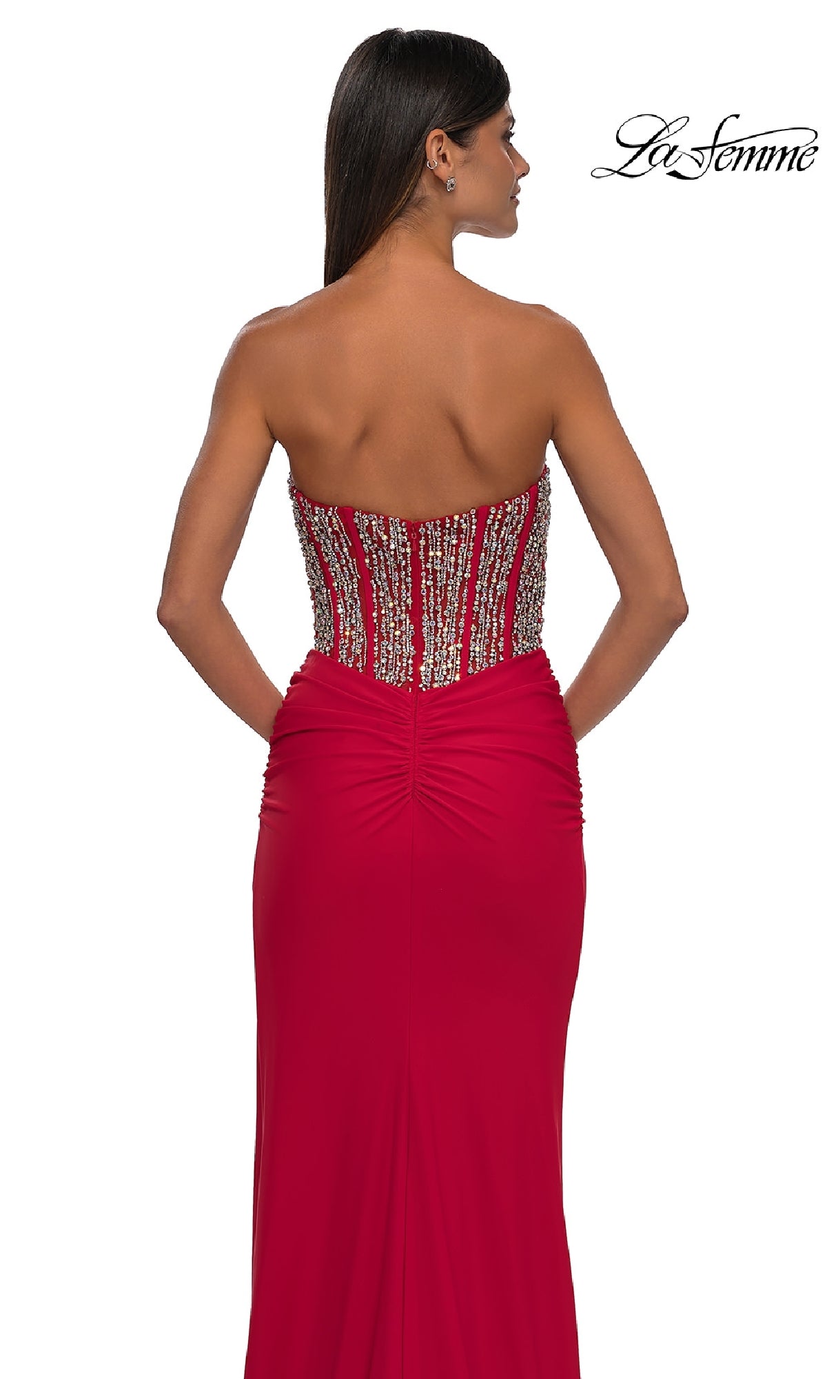 A woman is seen from the back wearing the La Femme 32669 Strapless Long Corset Prom Dress, featuring a beaded corset-style bodice. The La Femme logo appears in the top right corner.