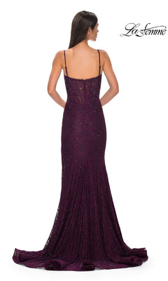 A woman faces away, wearing a floor-length dark purple La Femme 32671 prom dress with thin straps and a beaded-lace fitted mermaid corset silhouette. The brand name "La Femme" is in the top right corner.