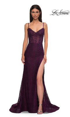 Woman wearing the Beaded-Lace Long Corset Prom Dress: La Femme 32671, featuring a dark purple sparkly beaded lace design, spaghetti straps, sheer bodice, and high side slit; standing on a plain white background.