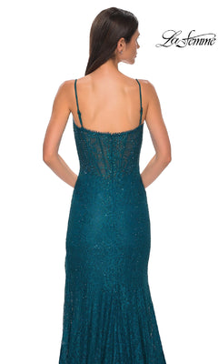 A woman wears the Beaded-Lace Long Corset Prom Dress (La Femme 32671) in teal, featuring spaghetti straps, sheer back detailing, and beaded lace. The La Femme logo is displayed in the top right corner.