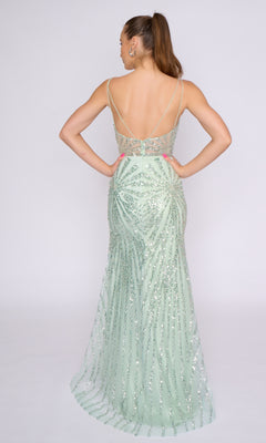 A woman stands with her back to the camera in a light green Nina Canacci 3267, a sleeveless long formal dress featuring floor-length sequins and a low back.