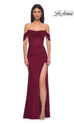A woman models the La Femme 32684 Off-the-Shoulder Corset Prom Gown in burgundy, featuring a thigh-high slit, against a plain white background. The La Femme logo is displayed in the top right corner.