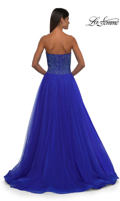 Woman wearing the La Femme 32690 Strapless Long Prom Ball Gown, featuring a sweetheart beaded bodice and tulle skirt, shown from the back against a white background.