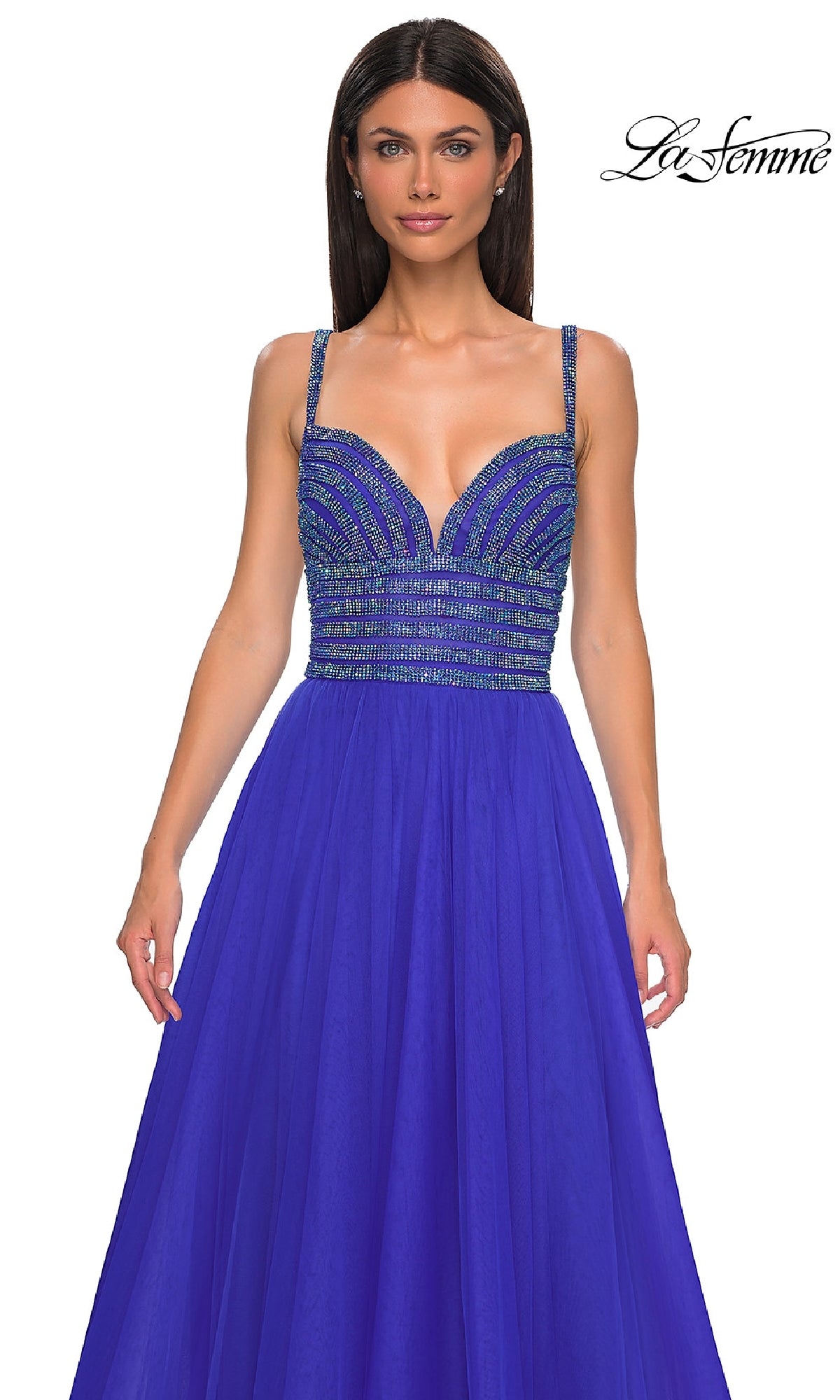 A woman wears the La Femme 32714 rhinestone-bodice prom ball gown in royal blue, featuring a sleeveless design and flowy skirt; 