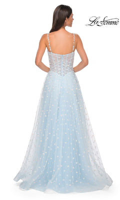 A woman is shown from the back wearing the Polka-Dot Long Prom Ball Gown: La Femme 32716—a light blue, floor-length dress with thin straps, fitted bodice, and flowing skirt. The "La Femme" logo appears in the top right corner.