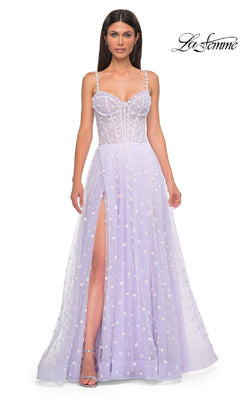 A woman wearing the Polka-Dot Long Prom Ball Gown: La Femme 32716—a light purple, sleeveless dress with a sheer corset bodice, high slit, thin straps, and flowy skirt.