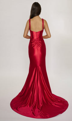 A woman with long dark hair faces away, wearing the Nina Canacci 3271 long formal dress in red satin, featuring a fitted corset bodice, dramatic train, and ruched detailing at the back.