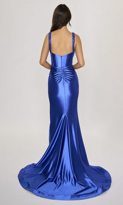A woman with long dark hair is seen from the back wearing the Nina Canacci 3271 long formal royal blue satin dress, featuring a fitted corset bodice and floor-length train, set against a plain light background.