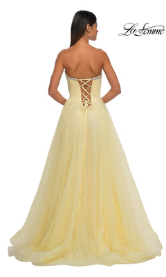 A woman faces away wearing the Strapless Long Prom Ball Gown: La Femme 32731, featuring a sweetheart neckline and lace-up back; "La Femme" is displayed in the top right corner.