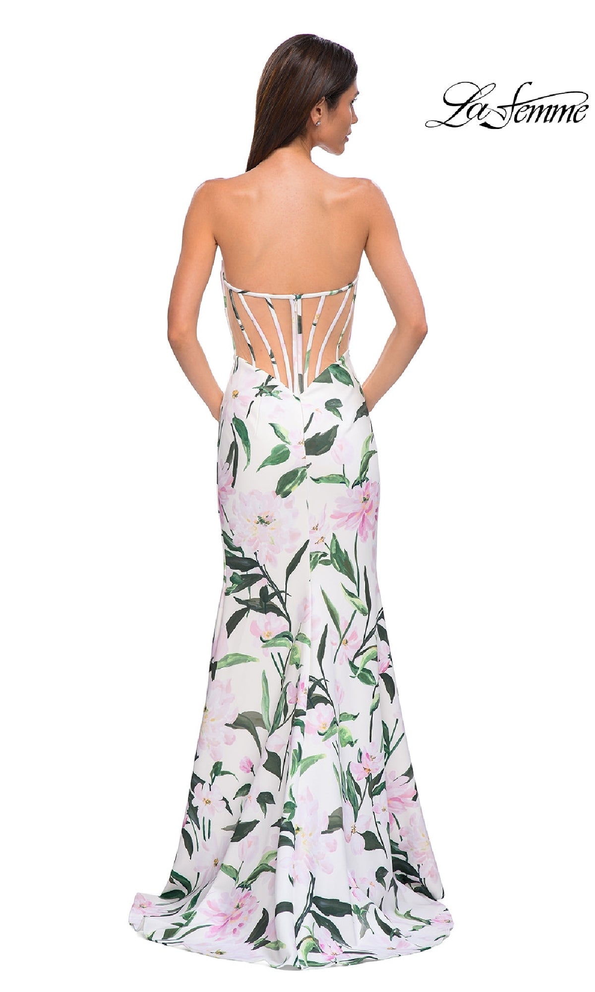 A woman wearing the La Femme 32752 Strapless Long Print Prom Dress stands with her back to the camera, showcasing its elegant design. The La Femme logo appears in the top right corner.