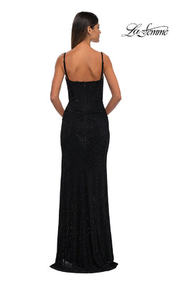 A woman faces away in a fitted, floor-length Classic Long Beaded Prom Dress: La Femme 32753 with thin straps, highlighting its stunning back details. The La Femme logo is visible in the top right corner.