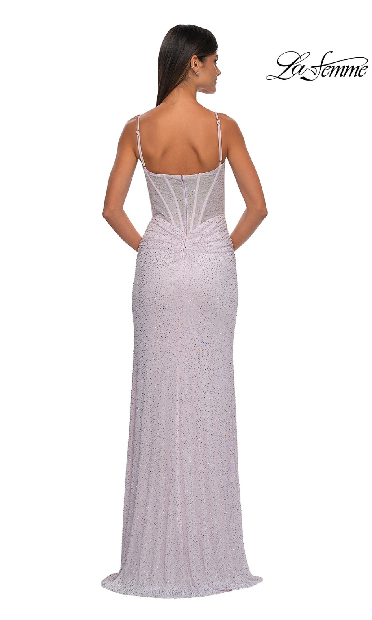 Woman shown from the back in a fitted, floor-length pale pink Classic Long Beaded Prom Dress: La Femme 32753 with thin straps, structured bodice, and subtle shimmer. The La Femme logo appears in the top right corner.