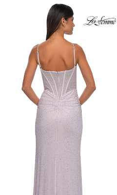 A woman is seen from the back in the Classic Long Beaded Prom Dress: La Femme 32753, a light purple fitted gown with thin straps, visible boning, and subtle waist ruching for a stunning formal look.