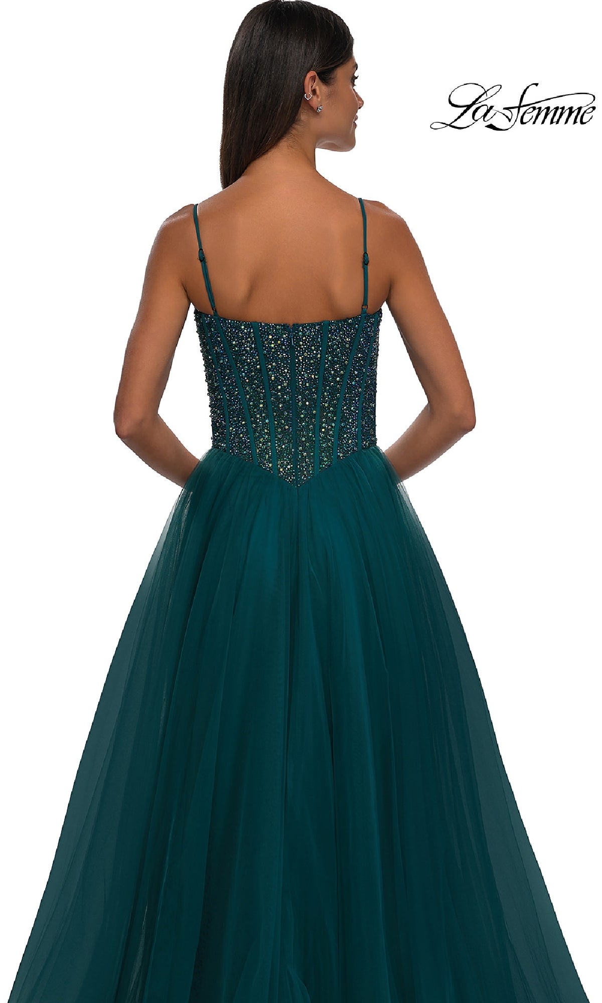 A woman is shown from the back in the Beaded-Bodice Long Prom Dress: La Femme 32754, a dark teal gown with thin straps, a beaded fitted bodice, and a tulle a-line skirt, set against a white background for an elegant look.