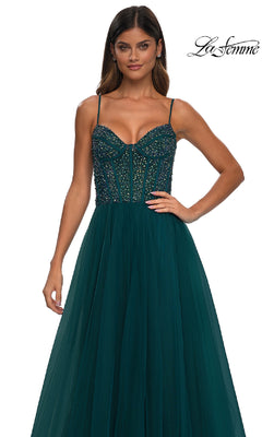 A woman wears the La Femme 32754 Beaded-Bodice Long Prom Dress, featuring a dark green fitted bodice with rhinestones and a tulle skirt, against a white background. The La Femme logo is displayed in the top right corner.