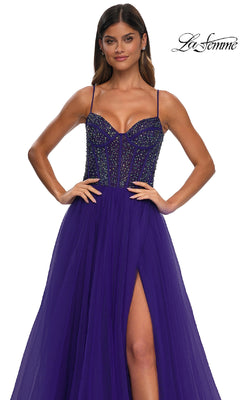 A woman wears the Beaded-Bodice Long Prom Dress: La Femme 32754, featuring a sleeveless deep purple design with thin straps, rhinestone-embellished bodice, and high slit skirt. The "La Femme" logo is in the top right corner.