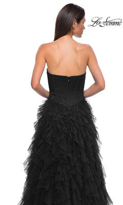 A woman is seen from the back in the Strapless Long Ruffled Prom Dress: La Femme 32760, featuring a fitted corset-style bodice and flowing A-line ruffles. The La Femme logo appears in the top right corner.