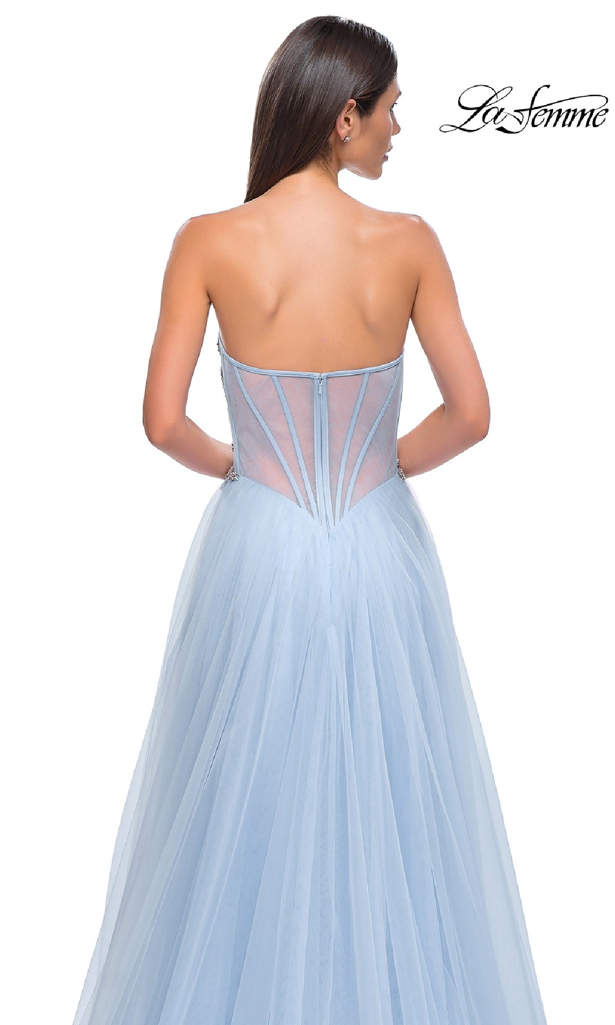 A woman is shown from the back wearing La Femme 32767, a strapless light blue tulle long prom ball gown with a sheer structured bodice. The La Femme logo appears in the top right corner.